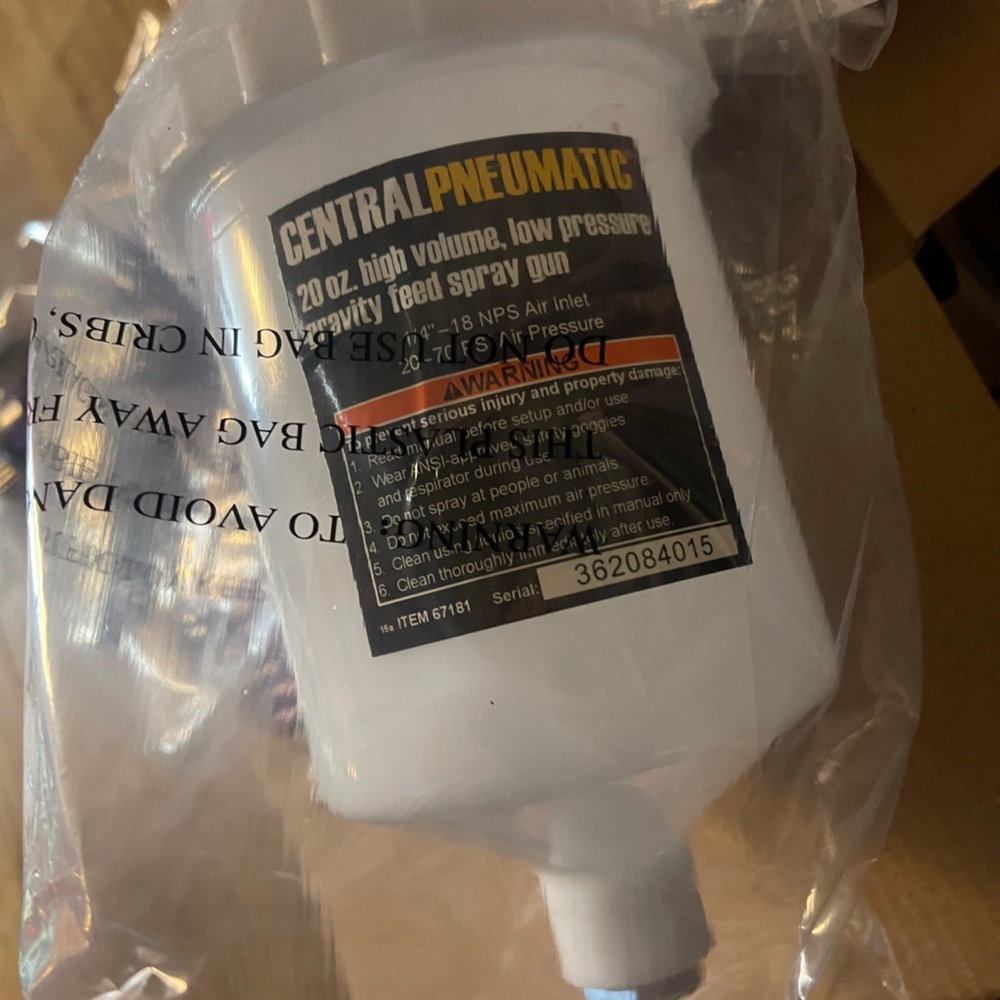 Central Pneumatic gravity feed gun and stand.